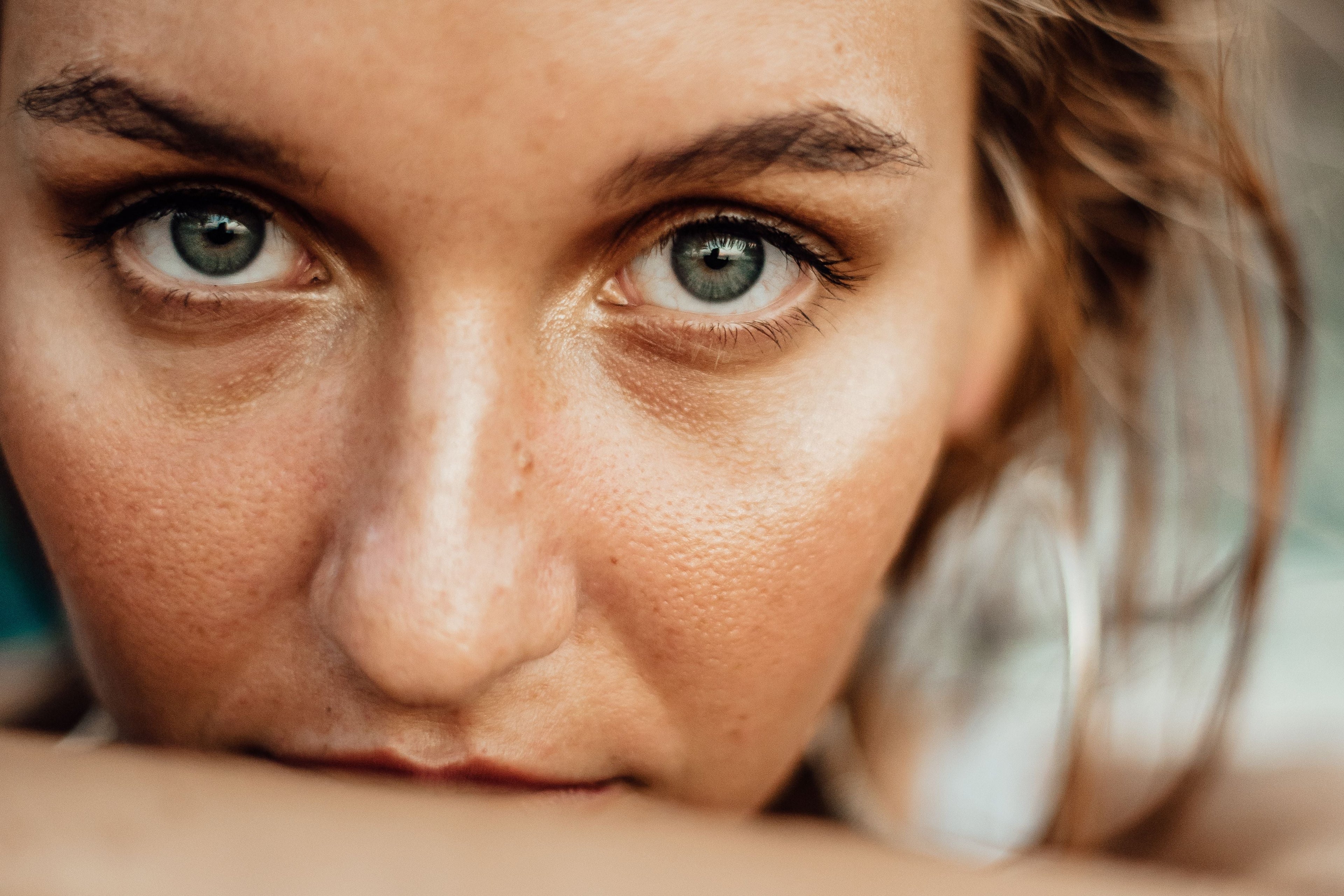 Close-up of smooth skin and skincare texture in soft natural light representing peptides and skin support.