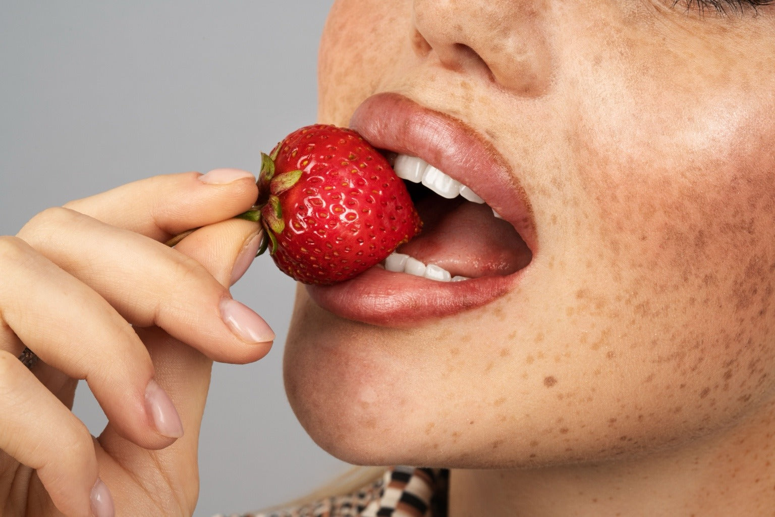Woman eating fruit vitamin C