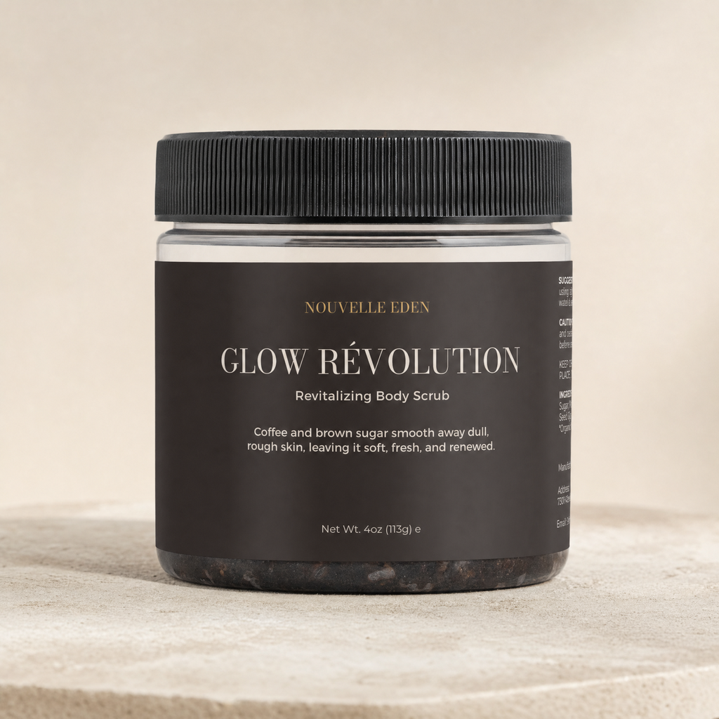 A jar of Nouvelle Eden Glow Révolution Revitalizing Body Scrub, featuring a black ribbed lid and a dark brown label with gold and white text, set against a neutral beige background.